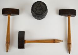 Three Masonic gavels and a secretary's carved bogwood or similar paperweight with textured bark