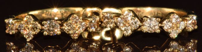 A pair of 9k gold earrings each set with eleven champagne diamonds from the Argyle mine, total