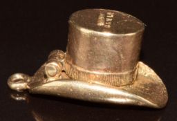 A 9ct gold charm in the form of a top hat opening to reveal a rabbit, 3.2g