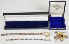 Two silver bracelets, silver ring and a hallmarked silver brooch in the form of an orchid set with