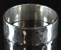 A bespoke silver bangle with hammered decoration, 144g, 7cm