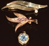 Two 9ct gold brooches, one set with amethysts and pearls and the other a pearl, together with a