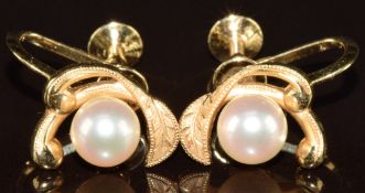 Mikimoto pair of 14k gold earrings set with a pearl in original box, 4g