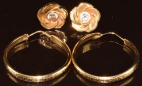 A pair of 18k gold earrings set with paste (3.6g) and a pair of yellow metal hoops (test as 18k, 6.
