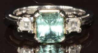 A 14k white gold ring set with an emerald mixed cut Paraiba tourmaline of approximately 1.7ct and