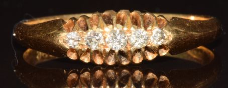 An 18ct gold ring set with five old cut diamonds, Chester 1913, 3g, size T/U