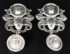 A pair of earrings attributed to Neiger, with embossed scarab and pharaoh decoration
