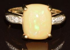 A 9k gold ring set with a Kalimaya opal cabochon of approximately 2.7ct and diamonds, with