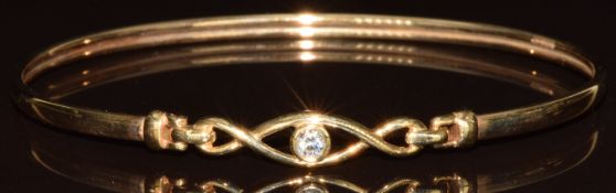 A 9ct gold bangle set with cubic zirconia, 3.9g