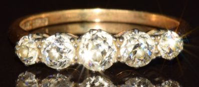 An 18ct gold ring set with five old cut diamonds, the centre diamond 0.4ct, total approximately 1.