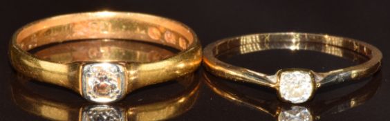 A 22ct gold wedding band set with a diamond in a platinum setting (size Q, 3g) and an 18ct gold ring