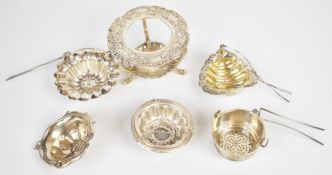 Victorian hallmarked silver tea strainer with shell shaped bowl and embossed floral decoration,