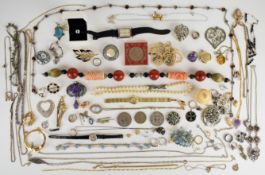 A collection of jewellery including five silver rings, two silver pendants, silver locket on