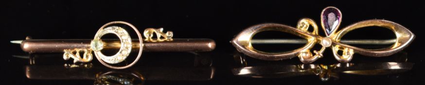 Two Edwardian 9ct gold brooches, one set with an aquamarine and seed pearls and the other paste