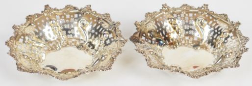 Pair of Mappin & Webb hallmarked silver bon bon dishes with pierced and embossed decoration, one