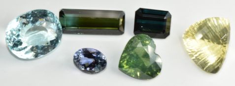 Six loose gemstones including oval fancy cut aquamarine of approximately 17.6ct, fancy cut lemon