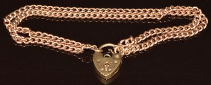 A 9ct rose gold bracelet made up of two strands of curb link chain, with 9ct gold heart padlock