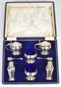 Walker & Hall Art Deco hallmarked silver cruet set comprising two each of spoons, pepper with