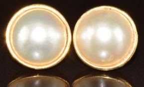 A pair of 18ct gold earrings set with mabe pearls, 7.7g