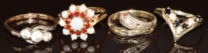 Two 9ct gold rings, one set with opals and garnets (one missing) and the other synthetic spinel, a