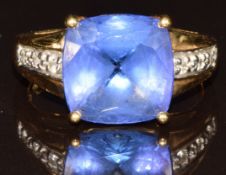 An 18k gold ring set with an antique cushion cut AAA tanzanite of approximately 5.3ct and