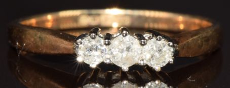 A 9ct gold ring set with three round cut diamonds totalling approximately 0.25ct, 2.3g, size Q