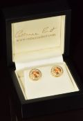 Catherine Best pair of 18ct gold earrings each set with a round cut mandarin garnet surrounded by