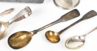 Hallmarked silver items to include cased spoon, napkin rings, mother of pearl handled knife,