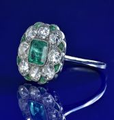 Art Deco platinum ring set with an emerald cut emerald of approximately 0.9ct surrounded by old