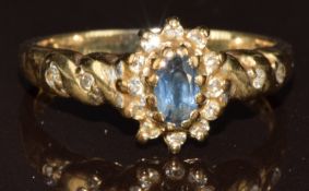 A 9ct gold ring set with a sapphire and diamonds, 2.4g, size M