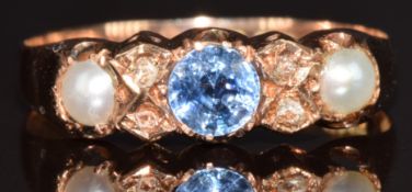 A 9ct rose gold ring set with a round cut cornflower blue sapphire of approximately 0.3ct,