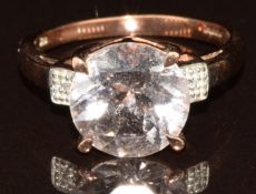 A 9k gold ring set with a round cut morganite of approximately 2.8ct and diamonds, with certificate,