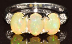 A 9k white gold ring set with three AAA Welo opal cabochons and diamonds, with certificate, 2.7g,
