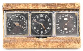 Turler traveling clock, barometer and calendar with black dials and folding faux snake skin