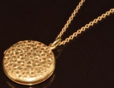 A c1900 18ct gold locket with engraved shamrock decoration, marked AW18C (2.5cm), on 9ct gold