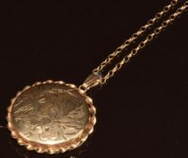 A 9ct gold locket with engraved floral decoration, on 9ct gold chain, 9.8g, 70cm