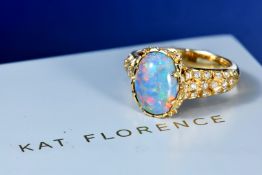 Kat Florence 18k gold ring set with a Lightning Ridge black opal of approximately 3.9ct and sixty-