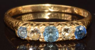 An 18ct gold ring set with three round cut sapphires and two round cut diamonds, 3.2g, size P