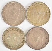 Four George V and George VI crowns comprising three 1935 rocking horse examples and a 1937