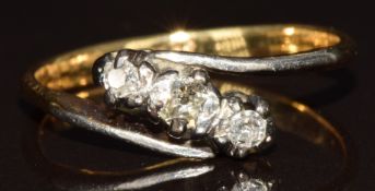 An 18ct gold ring set with three diamonds in a platinum setting, 2.4g, size J