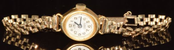 Technos gold plated ladies wristwatch with blued hands and Arabic numerals and silver dial, on 9ct