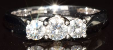 An 18k white gold ring set with three diamonds of approximately 0.28, 0.18 and 0.18ct, 4g, size O