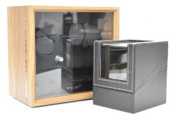 Two automatic watch winders / display cases comprising one two watch winder with black faux