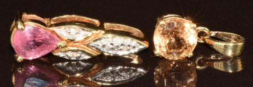 An 18k gold pendant set with a pear cut pink sapphire and diamonds, and a 9k gold pendant set with