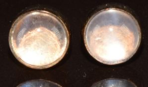 A pair of 9ct gold earrings each set with a moonstone cabochon, 1g
