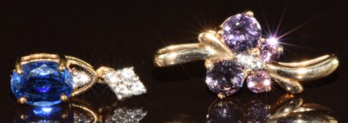 A 9k gold pendant set with an oval cut kyanite and white sapphires and a 9k gold pendant set with