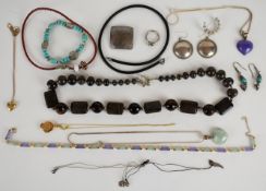 A collection of jewellery, some silver including two chains, ring, pair of earrings and a pendant; a