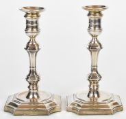 Pair of Edward VII/George V hallmarked silver candlesticks with knopped stems and square bases