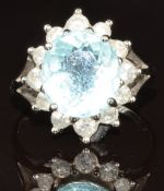 A white metal ring set with an oval cut greenish blue Paraiba tourmaline of approximately 3.6ct
