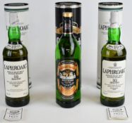 Three bottles of single malt Scotch Whisky comprising two Laphroaig 10 Years Old and one